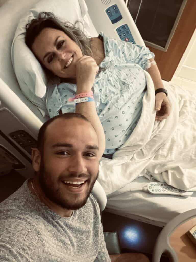 Natalie in hospital bed, smiling